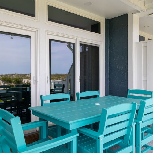 Enjoy open-air meals with ocean scents drifting in from the nearby shore.