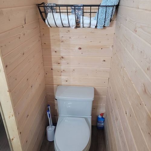 Bathroom:  very cute full bathroom with sink, vanity, mirror, shower, and toilet
