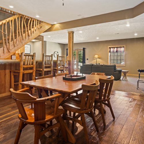 Lower level:  great family space in the lower level with dining table, wet bar, games, sofa, and television.