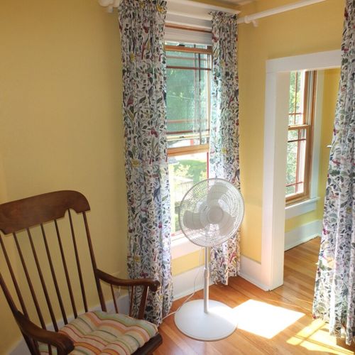 Bedroom #4 (second floor):  this very cute upstairs bedroom features two twin-size beds, a nightstand, lamp, pedestal fan, chair, and a large walk-in closet.