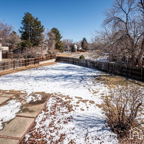- large fenced backyard with mature trees, spacious layout, and wintertime charm
- perfect for snowball fights or summer barbecues once the weather warms up
- patio area and plenty of open ground for lawn games or stargazing nights