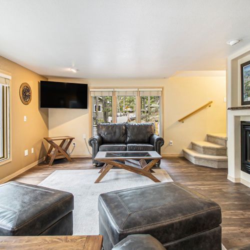 Open-layout living room designed for ultimate relaxation & nature views.