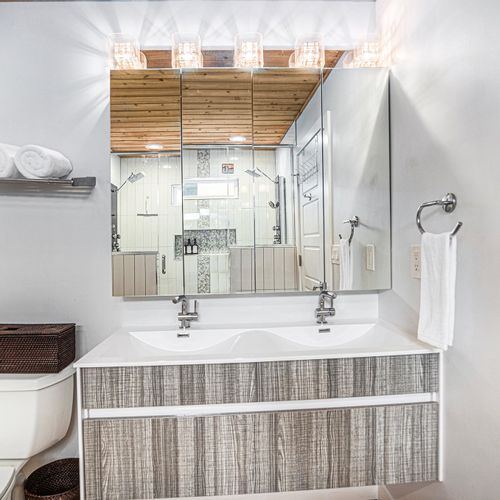 Modern bathroom with walk-in shower and luxury finishes.