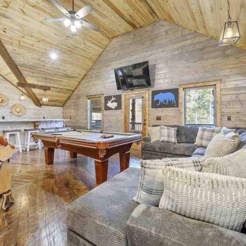 Oversized sectional for guests to relax or wait their turn to play some pool!