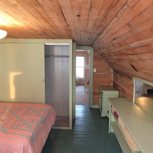 Bedroom #4 (second floor):  features 2 full-size beds, dresser, closet, and great views of crystal lake!