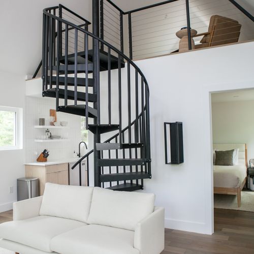 Spiral staircase infront of the first floor bedroom.