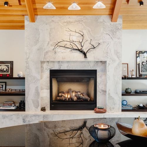 Gas fireplace with easy thermostat control located on the wall