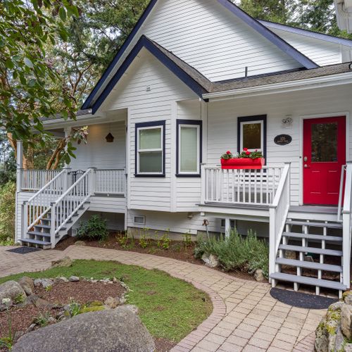 Enter through the mud room or keep going to head up to outdoor seating on the balconies.