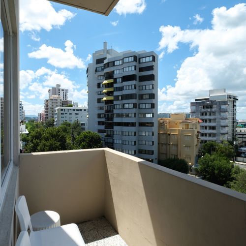 Enjoy the vibrant city life from your private balcony, offering a refreshing view of the surrounding architecture and a glimpse into the local ambiance.
