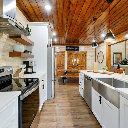 2 ovens, a dishwasher, ample amounts of counter space and an oversized sink!