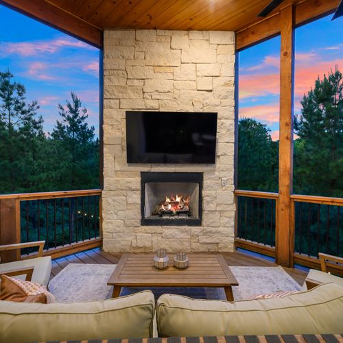 Outdoor couch and lounge seating around the gas fireplace