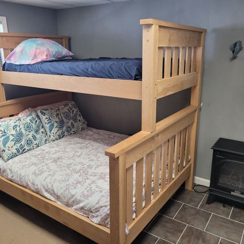 Bedroom:  cute bedroom with a twin-on-full bunk bed, electric heater, fan, 2 dressers, closet, lamp, and a television.