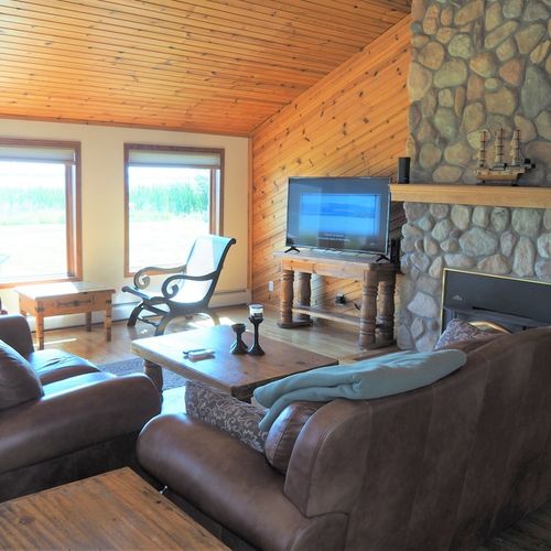 Living room:  the cabin has a huge living room with a gas fireplace and 
 great lake views!