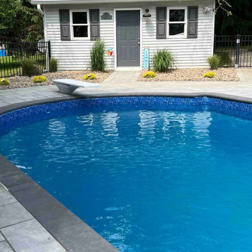 Surrounding trees make for the perfect place to soak. Please note: diving board no longer available.
