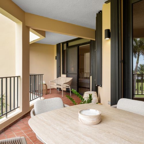 Step onto your private balcony and savor refreshing breezes with glimpses of the sparkling pool. Your perfect escape!