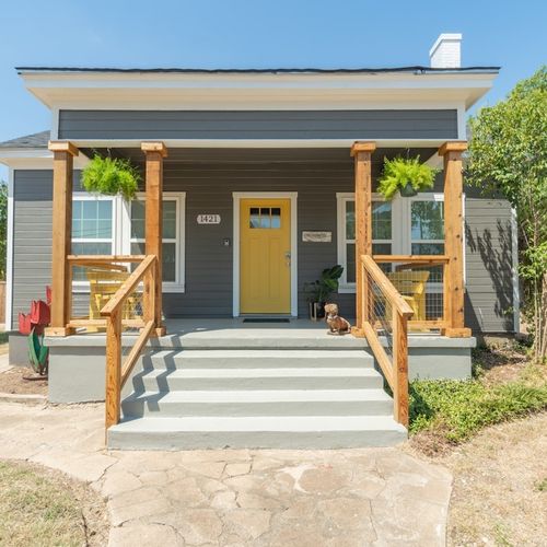 The bright and sunny porch of the main house with seating for morning coffee and quiet time.
