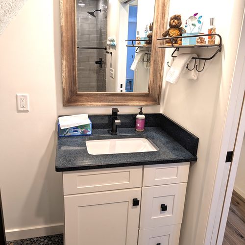 BATHROOM #2 (UPPER LEVEL):  Full bathroom on the upper level with a walk-in shower.