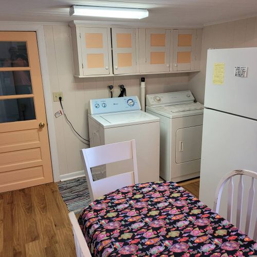 KITCHEN AND DINING AREA:  Full kitchen with a good supply of cooking and dining utensils.  Also includes dining area and washer and dryer.