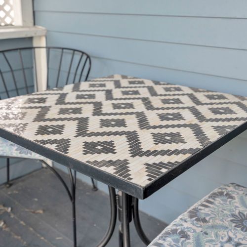 Sip your morning coffee at the porch table surrounded by easy, breezy charm.