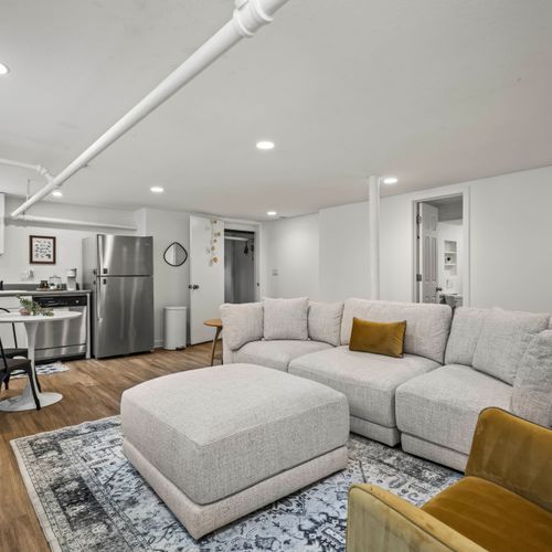 Sleek style with cozy cushions in the basement living room