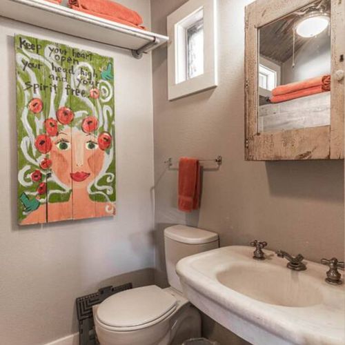 The ensuite bathroom with a walk in shower stocked with all the essentials in the cabin