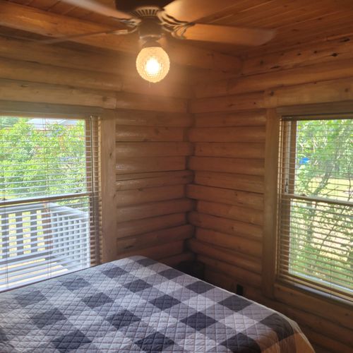 Bedroom #1:  the first of the two cute and comfy downstairs bedrooms with a queen bed, a closet, and a ceiling fan