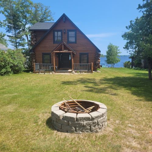 Overall:  the beautiful stone firepit near the frontside of the building