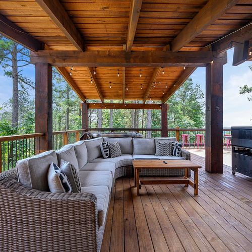 An oversized sectional sits on the patio for all to enjoy.