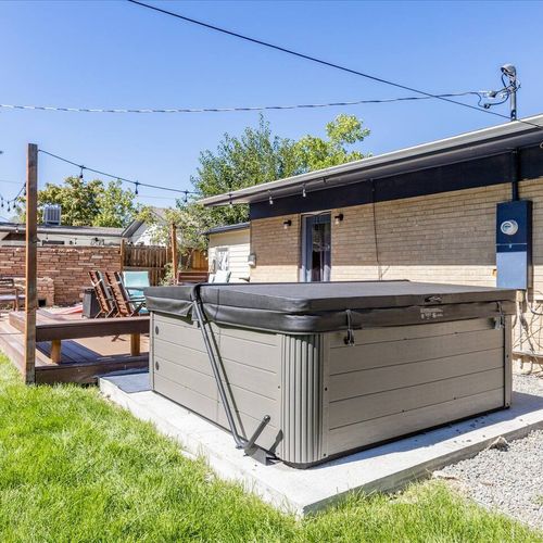 - unwind in the private outdoor hot tub surrounded by grass and café lights
- perfect for starry nights or sunny afternoons with friends and family
- relaxation meets fun in this fenced backyard with plenty of room to gather