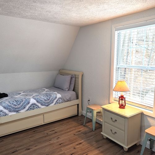 BEDROOM #4 (UPPER LEVEL):  Features 3 trundle beds, which are single beds with a second single bed that rolls out from underneath.  As such, the bedroom effectively has 6 single beds.