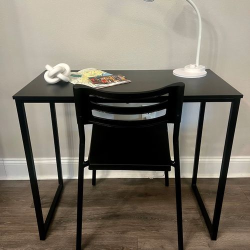 Clean desk setup by the window — get things done in a quiet corner.
