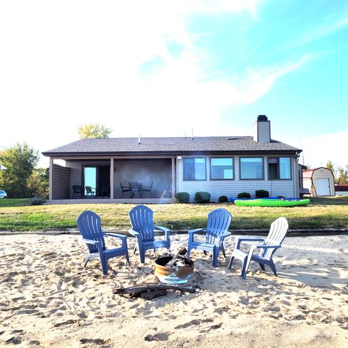 OVERVIEW:  Looking up at the house from the private beach on Lake Huron