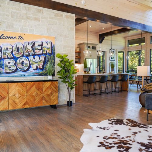 Glass and Timber is where plush leather, luxe textures, and soaring ceilings collide—your cozy haven awaits.