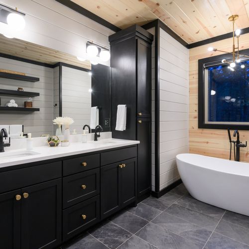 This Master bathroom also has a luxury soaking tub.