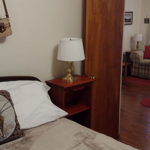 Bedroom #2:  features a full-size bed, nightstand, lamp, dresser. And closet.