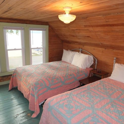 Bedroom #4 (second floor):  features 2 full-size beds, dresser, closet, and great views of crystal lake!
