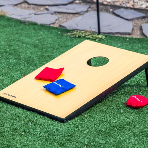 Challenge friends or family to a lively cornhole showdown outside.