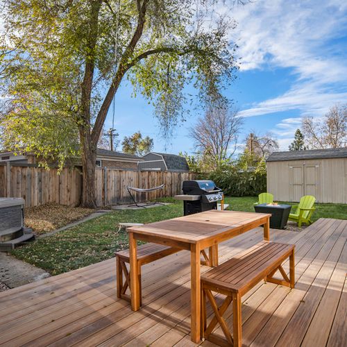 Relax and dine al fresco on the spacious patio, featuring a picnic table perfect for meals, games, or enjoying the fresh air.