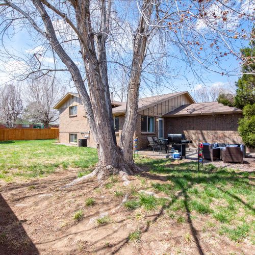 A secure and inviting fenced yard, perfect for outdoor activities and relaxation. Please note the patio furniture may be put into storage during the winter months.