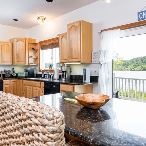 Kitchen:  the home has a large modern kitchen with all appliances, a large kitchen island with seating, and great views of betsie lake!