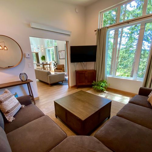Sink into the sectional for a movie night with the forest glowing just outside your window