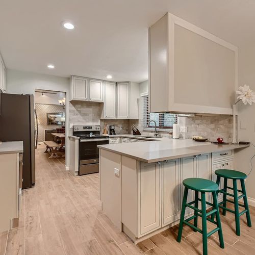 With bar stools and a kitchen table with much seating, this kitchen also provides an inviting space for hanging out with your loved ones.