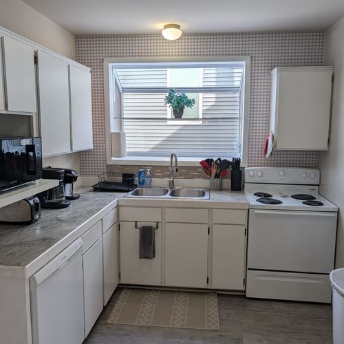 KITCHEN:  Recently updated kitchen with all appliances including a dishwasher and a good supply of cooking and dining utensils.