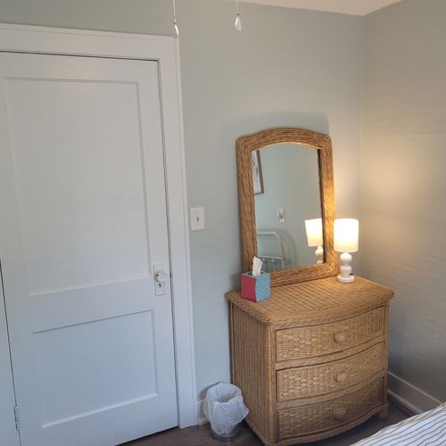BEDROOM #2:  Features a full-size bed, dresser, lamp, mirror, and closet.
