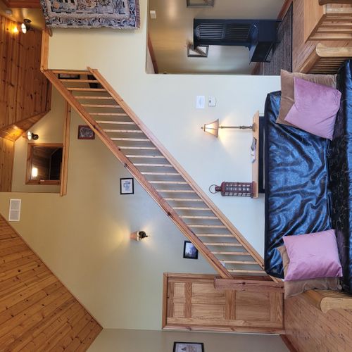 Living room:  gorgeous living room with 2 futons, an electric fireplace, and a lovely view of long lake!