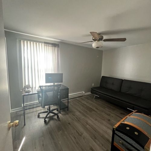 Bedroom #2 (main floor):  includes a futon, workstation (desk, chair, and monitor), ceiling fan, closet, and another lovely lake view!