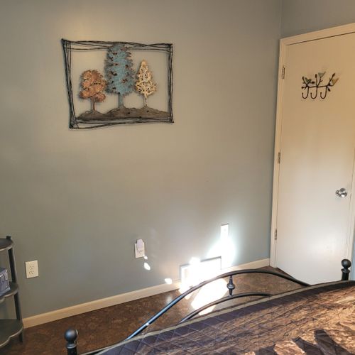 Bedroom #2 (second floor):  features a queen-size bed, nightstands, lamps, and a closet.