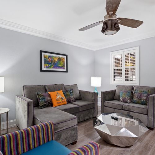 Cozy sitting room w/ plush sofas & natural light pouring in
