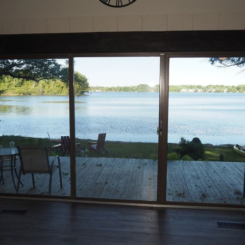 Living room:  the cottage has a cozy living room with a great view of bass lake. Includes live-streaming television with hulu, hbo max, pureflix, netflix, and disney+. (guests are not permitted to use the wood fireplace. )