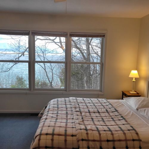 Bedroom #2 (upper level):  features a queen-size bed, great views of lake michigan, dresser, mirror, closet, desk, and private en suite full bathroom!